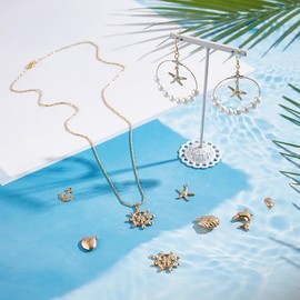 UNICRAFTALE Nautical Pendants: Anchor, Starfish, Dolphin, Helmet, Shell, DIY Stainless Steel Pendant in Gold for Necklaces, Bracelets, Earrings & More Pack of 28