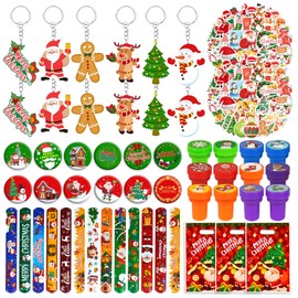 Tazimi 110 PCS Christmas Party Favors Christmas Tree Snowman Santa Claus Party Favors with Keychains Stickers Bracelets Button Pins and Bags for Christmas Theme Party