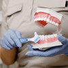 Pack of 4 denture cleaning brushes and 4 pieces interdental