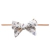 Copper Pearl Classic Baby Bow Wizarding World™