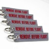 Rotary13B1 - Remove Before Flight Keychain - Gray/Red 5pcs