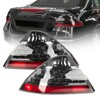 A pair of Smoke Taillights with bulbs for Honda 2006-2007