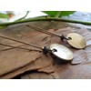 Thick bronze discs and ceramic earrings and kidney hooks