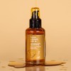 Nourishing body oil that nourishes, tightens and fights Golden Radiance