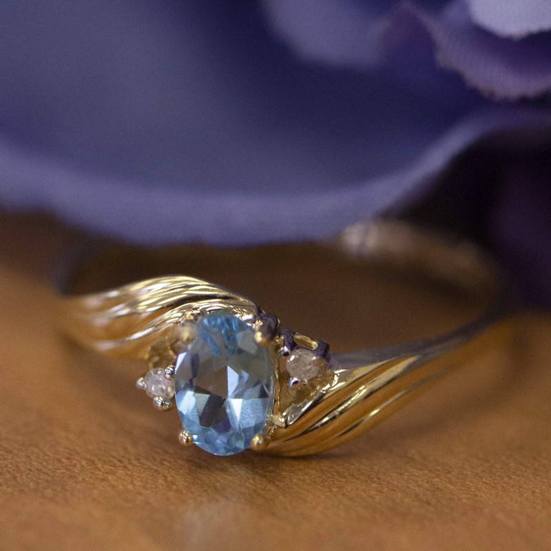 10k Yellow Gold Oval Blue Topaz And Diamond Ring (Size