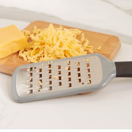 RSVP International Paddle Grater, Etched Steel Blades, Stainless Steel Hand Held Kitchen Cheese & Vegetable Shredder Comfort Grip Handle and Anti-Slip Foot, Safety Cover Included, Extra-Coarse