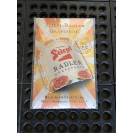 Stiegl Grapefrui Radler Beer Tin Sign. Measures 7 3/4” Wide. 11 3/4” Tall.  New.