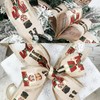 Wired Edge Christmas Ribbon with Glitter, Nutcracker Ivory Satin Toy