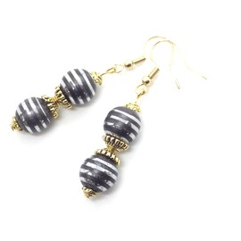 Ohrringe aus schwarzen Hämatit- und Chromperlen und goldenen tibetischen Perlen