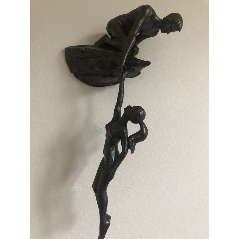 Haute Collage Man on cliff edge holding a hanging woman