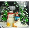 Snow Globe Snowman Standing Next to Child on Sleigh Base