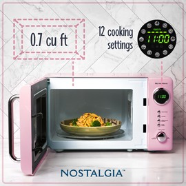 Nostalgia Retro Compact Countertop Microwave Oven 0.7 Cu. Ft. -700-Watts with LED Digital Display-Child Lock-Easy Clean Interior-Pink