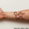 'Sitting Baby Monkey' Temporary Tattoo - Water Resistant, Skin-Safe, Non-Toxic