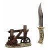 Western Horse Saddle By Wagon Wheel With Blunt Knife Display