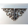 Pair of small cast Iron wall mounted antique style leaf