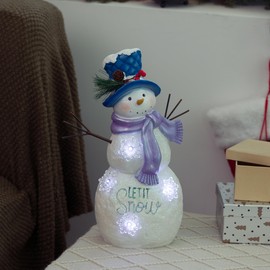 Alpine Corporation SKY558HH-S Lavender Winter Let It Snow Snowman Statue with Fading LED Lights, 14” Tall, Indoor/Outdoor Use, Festive Holiday Decoration