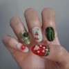 Handmade nail tip for a bear missing a watermelon in