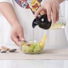 Salad dressing shaker, with measuring scale, removable mixing disk and