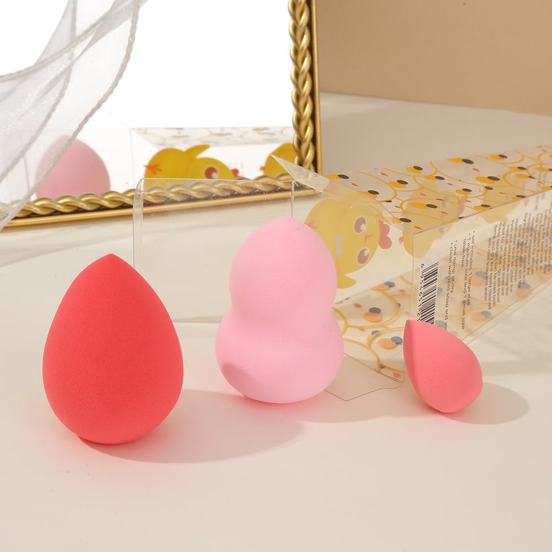 A set of two large and one mini makeup sponge
