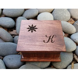 Custom made wooden music box with a sun and a monogram engraved on the top with personalizing options, you can choose your color and song by simplycoolgifts