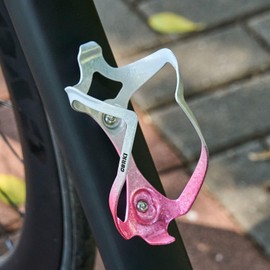 Corki Cycles Universal Bike Water Bottle Holder, Heavy Duty Aluminum Alloy Shock-Resistant Cage for Road Mountain Gravel Bikes 21-32 oz Capacity White Pink 1 Pack