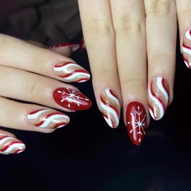 CEWEWP Winter Snowflake Press on Nails Medium Christmas Almond Fake Nails with Red,White,Gold,Glittering Pink Wave Stripes Design Stick on NailsXmas Glue on Nails Glossy Acrylic Nails for Women 24Pcs