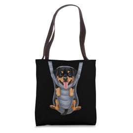 Funny Rottweiler Puppy In A Baby Carrier. Dog Lover Tote Bag