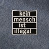 Finally Home Iron-On Patch "Kein Mensch ist illegal" [German Language]