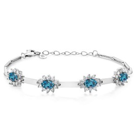 Gem Stone King 925 Sterling Silver London Blue Topaz and White Created Sapphire Bracelet For Women (4.00 Cttw, Gemstone November Birthstone, Oval 6X4MM, 7 Inch + 1 Inch Extender)