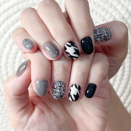 24Pcs Black and White Space Fake Nails,Oval Short False Nails with Glitter Designs，Almond Press on Nails Stick on Nails for Women Nail Art