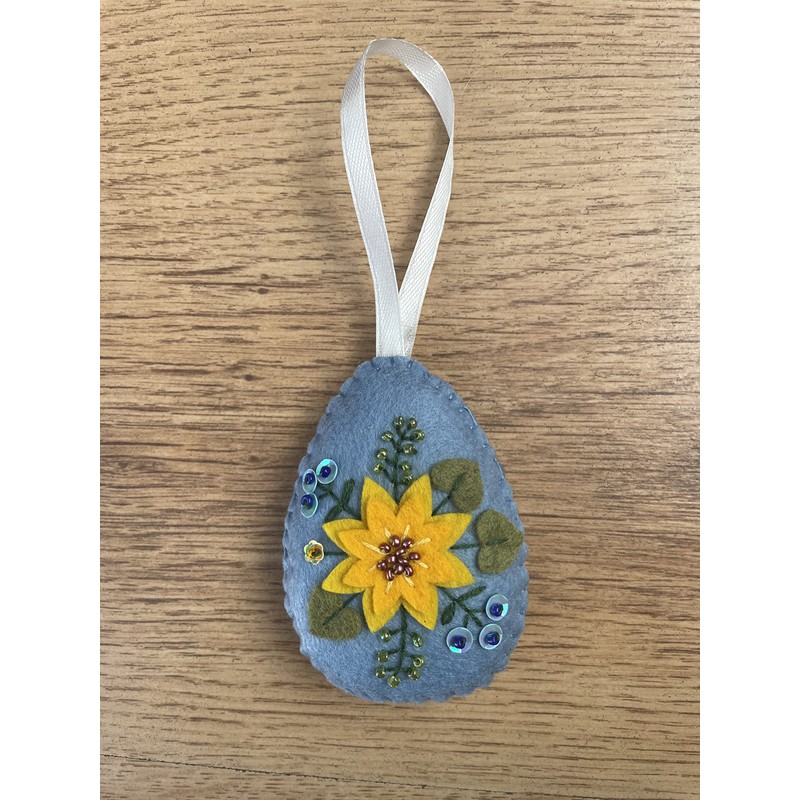 Handmade felt Easter decoration Easter egg with yellow flower