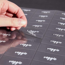 Restaurantware Label Tek 1.9 x 1 Inch Veggie Juice Bottle Labels 100 Water-Resistant Labels For Bottles - Self-Adhesive Clear With White Font Plastic Bottle Stickers For Drink Pouches