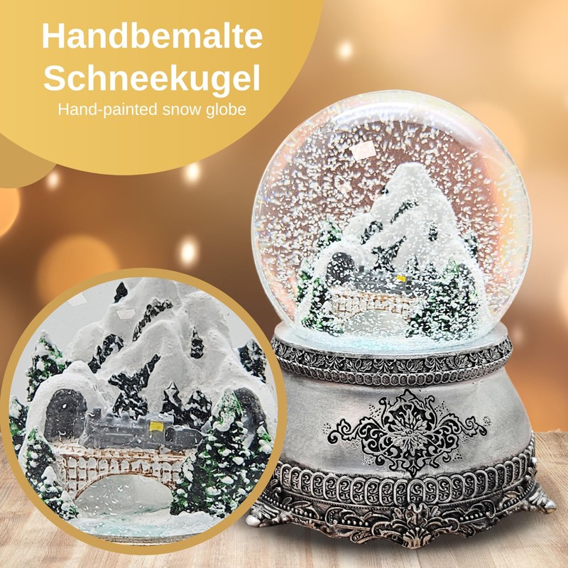 Snow globe mountain landscape with bridge, pewter effect ornaments, with