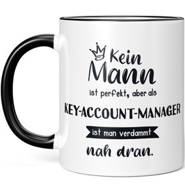 JUNIWORDS Tasse, Kein Mann ist perfekt, aber als Key-Account-Manager ist man verdammt nah dran, Schwarz (6355724)