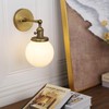 Pathson Hardwired Wall Sconce with White Globe, Brass Bathroom Vanity