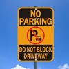 No Parking Sign, Do Not Block Driveway Sign. Yellow and