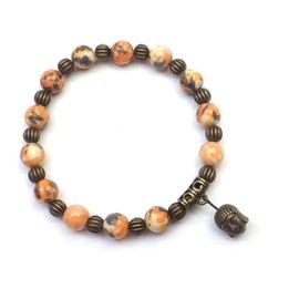 Tibetanisches Vintage Armband für Frau in getönten Jade Perlen in Orange und Schwarz mit Buddha Kopf Charms