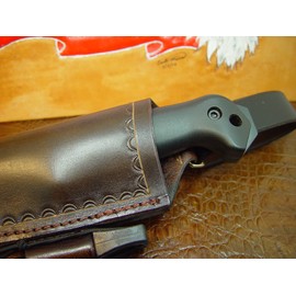 This Is a New Sheath Made Out of 10 Ounce Water Buffalo Hide Leather. It Is a Dangler Style and Also Can Be Worn As a Regular Belt Type Sheath By Removing the Dangler. It Comes with a Firestarter . The Sheath Is Died Dark Brown. The Sheath Is Made to Be 