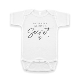 Surprise Pregnancy Announcement Infant Bodysuit - We've Been Keeping A Secret - New Baby Reveal Gift for Friends and Family (White)