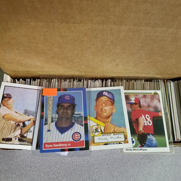 600 Baseball Cards Including Babe Ruth, Unopened Packs, Many Stars, and Hall-of-famers. Ships in Brand New White Box Perfect for Gift Giving. Includes At Least One Original Unopened Pack of Topps Vintage Baseball Cards That Is At Least 25 Years Old!