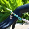 Pulsera con Mano de Fátima (Hamsa) y Flor de Lluvia