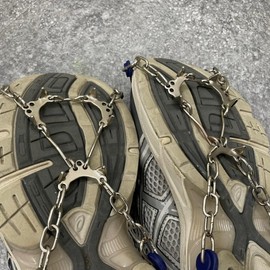 Urban city chain on snowy and icy roads Crampons