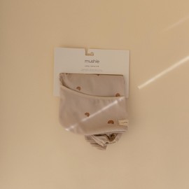 mushie Long Sleeve Baby Bib | Mess Free & Waterproof Fabric for Toddlers | Adjustable Fit for Ages 6-24 Months (Rainbows)