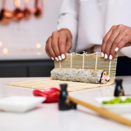 Joyce Chen 4-Piece Sushi Bundle, Includes Sushi Board, Sushi Roller, 10-Pairs Bamboo Chopsticks, and a 10x15 inch Bamboo Cutting Board