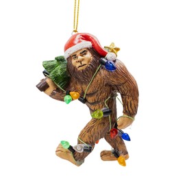 Ugly Bigfoot Wearing Santa Hat Walking with Tree Wrapped in Christmas Lights Sasquatch Funny Ornament