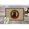 Caroline's Treasures DAC2322MAT Black Russian Terrier Christmas Flowers Doormat Front