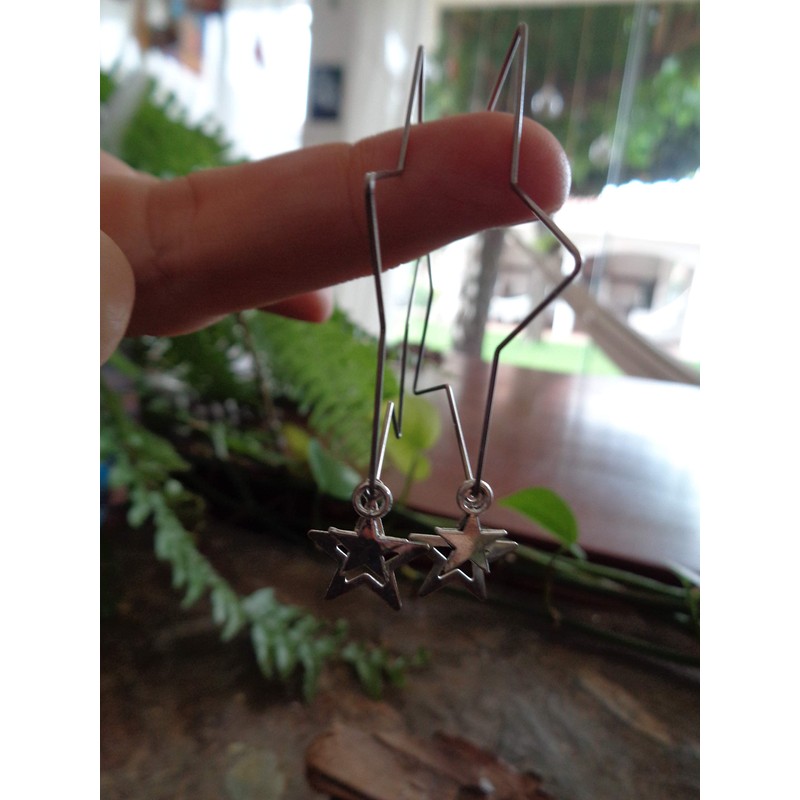 Delicate star hoop earrings made of stainless steel. Star-shaped large