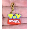 Toy Story Logo Word Charm Gold Zipper Pull & Keychain