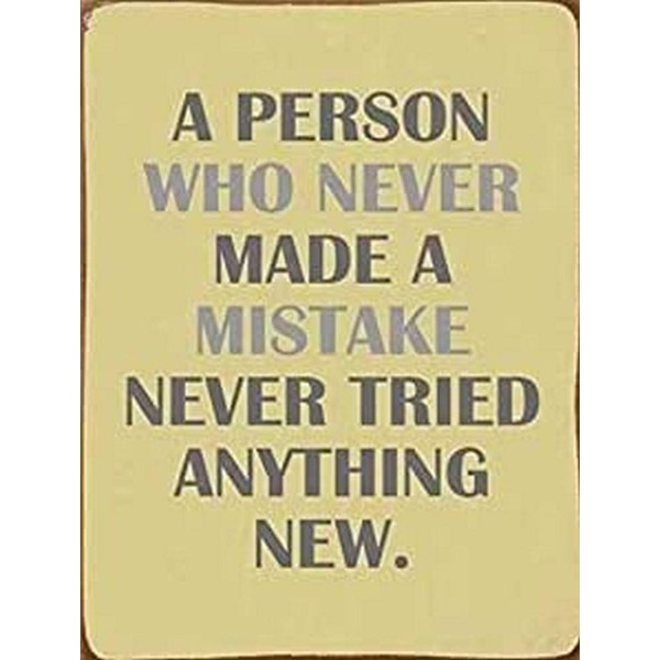 Sign - A person who never made a mistake, never tried anything new