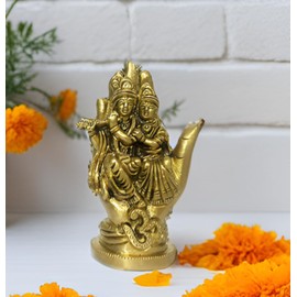 Purpledip Brass Idol Radha Krishna: Seated on Hand Shape Throne with Om (12170)